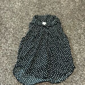 Black and white polkadots short sleeve blouse with collared neck. Size is medium